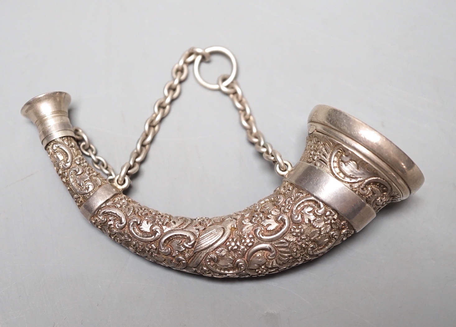 A Victorian novelty silver combination vinaigrette/scent flask, by Sampson Mordan & Co, Birmingham, 1894, 10.7cm, embossed with birds amid scrolls.